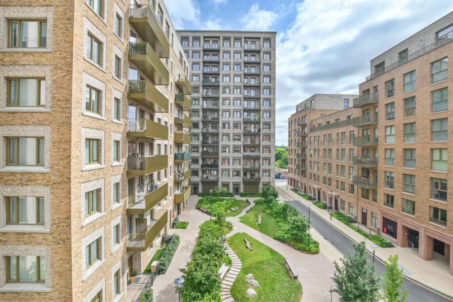 External view of build to rent development around a central park courtyard