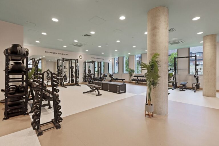 Modern residents gym at UNCLE Wembley with free weights and strength equipment
