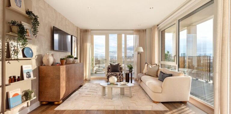 Bright open plan living room with floor to ceiling windows and private balcony