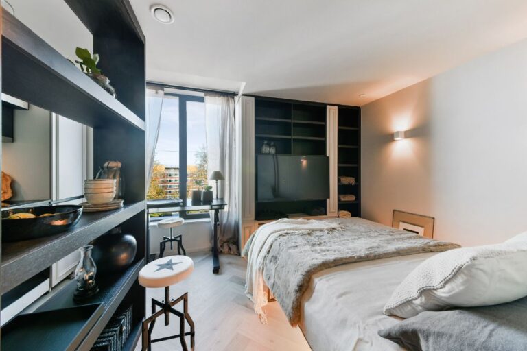 Modern studio interior with fold away bed and contemporary finishes