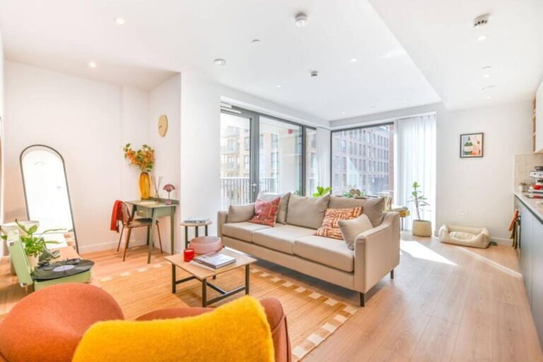 Bright open plan living room with balcony