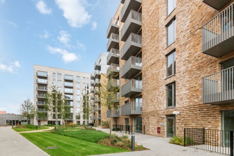 Exterior courtyard and apartment buildings at UNCLE Deptford build to rent development