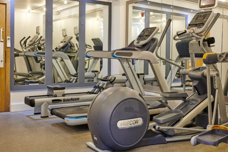 On site gym at UNCLE Stockwell with cardio machines and mirrored walls