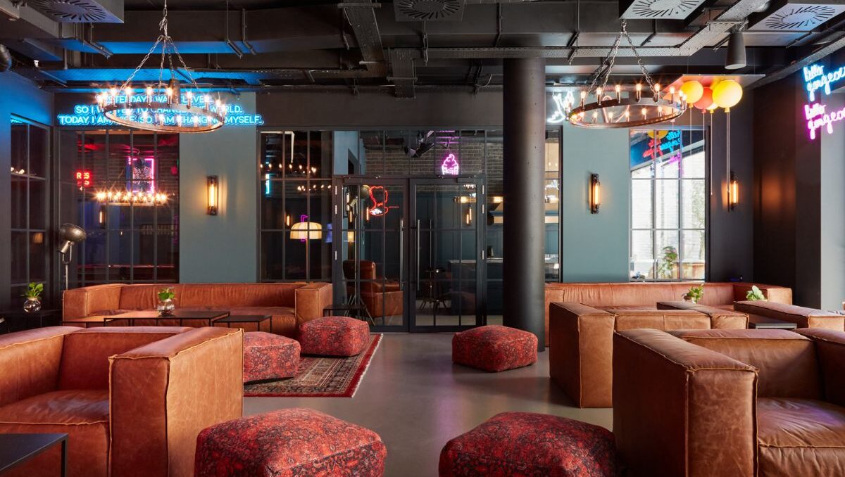 Resident lounge at Dandi Battersea with seating, neon lighting and social space