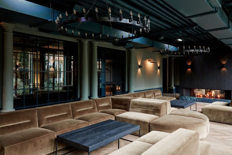 Resident lounge at Dandi Brondesbury featuring fireplace and soft seating