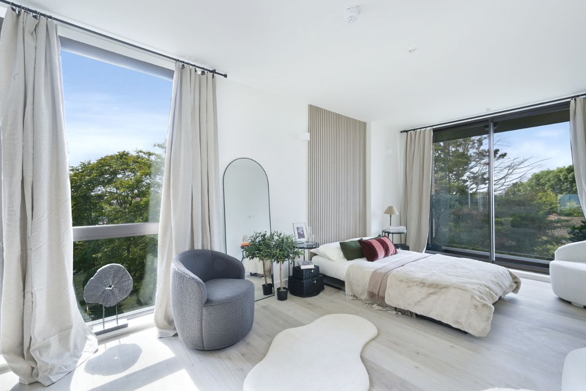 Spacious studio apartment with seating area and balcony access