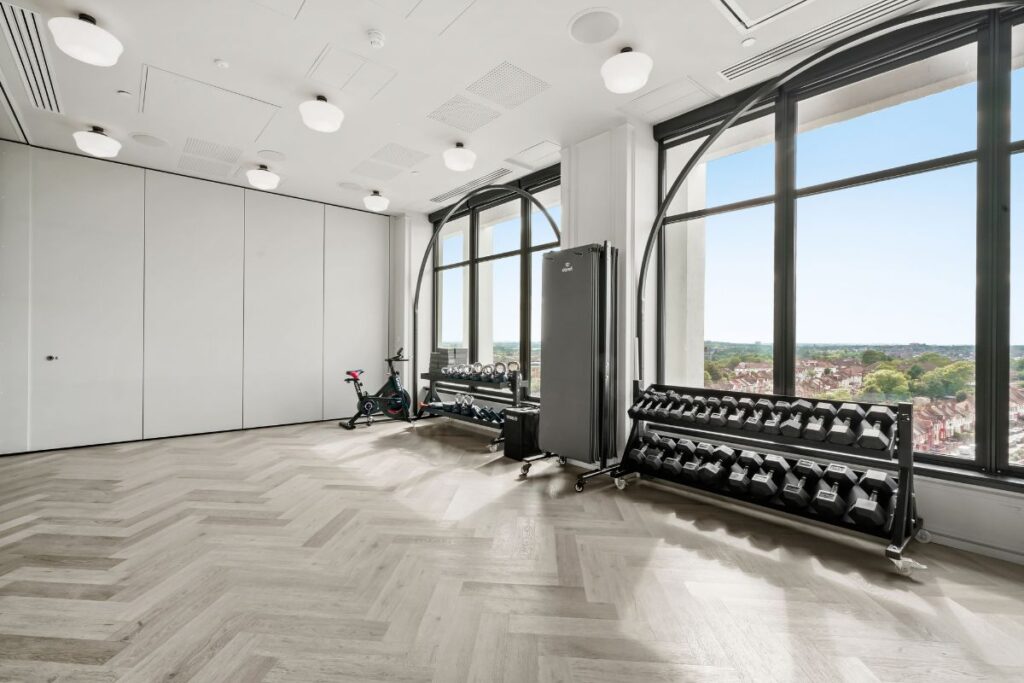 Dandi Wembley residents gym with free weights and large windows