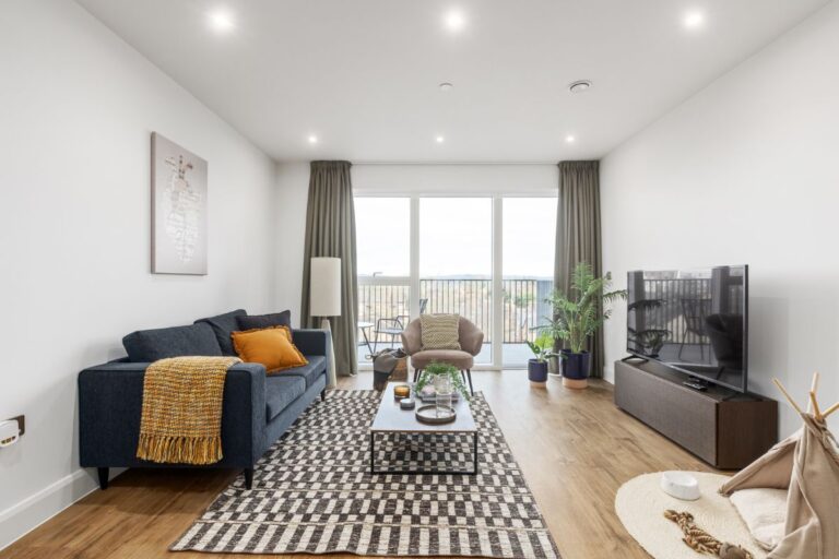 Open plan living room with balcony at UNCLE Colindale build to rent apartments