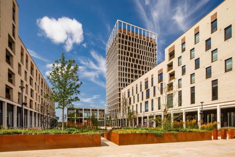 Modern residential tower and low rise apartment blocks with landscaped grounds
