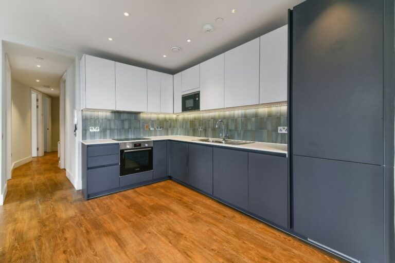 Contemporary fitted kitchen at UNCLE Wembley with integrated appliances