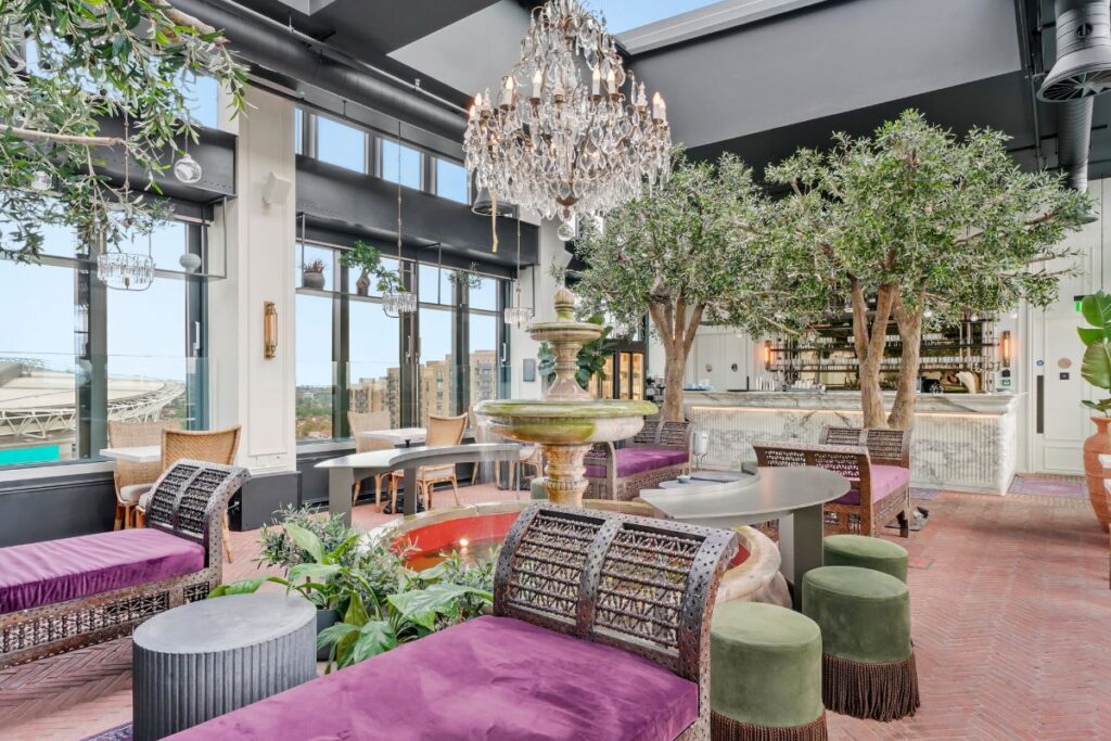 Dandi Wembley top floor lounge with fountain seating and landscaped greenery