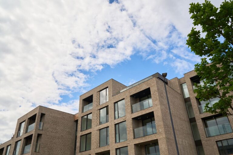 Modern brick apartment building with balconies in Harrow