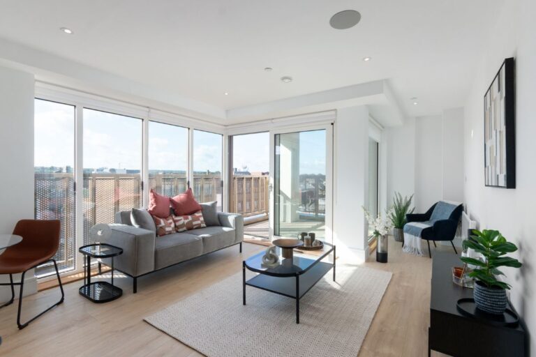 Open plan living and dining area in a two bedroom apartment at Sutton Park House with private balcony