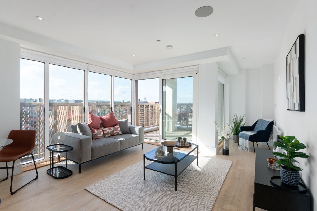 Open plan living and dining area in a two bedroom apartment at Sutton Park House with private balcony