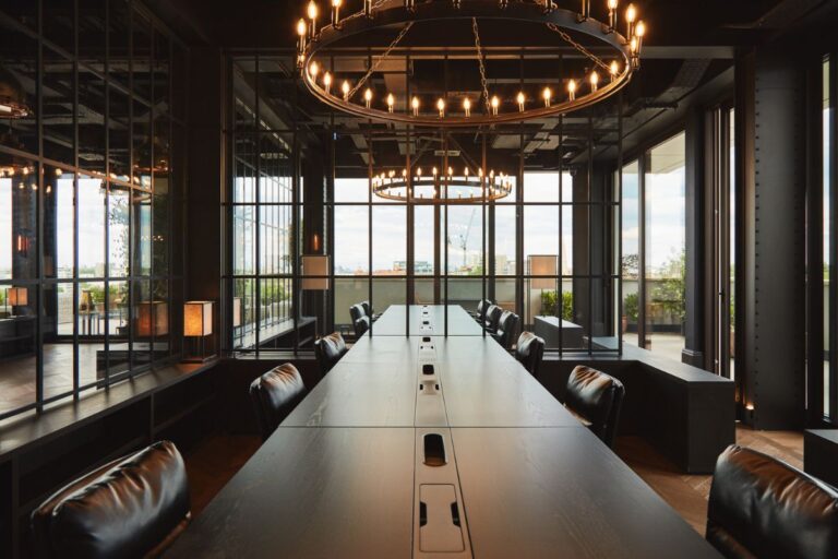 Meeting room at Dandi Battersea with long table, workspace seating and large windows