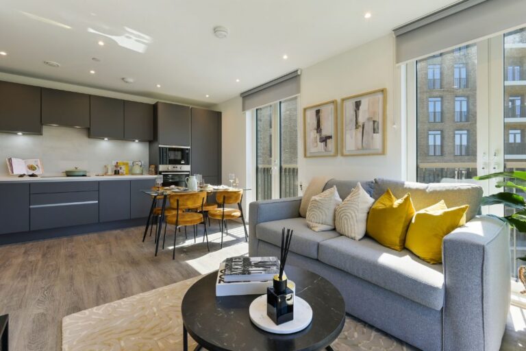 Open plan living and dining space at Wolff House with balcony access