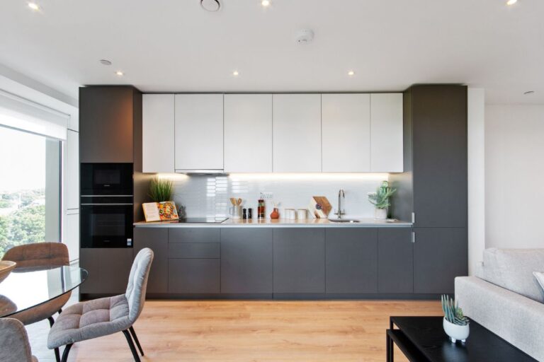 Contemporary kitchen at Sutton Park House with integrated appliances and sleek cabinetry