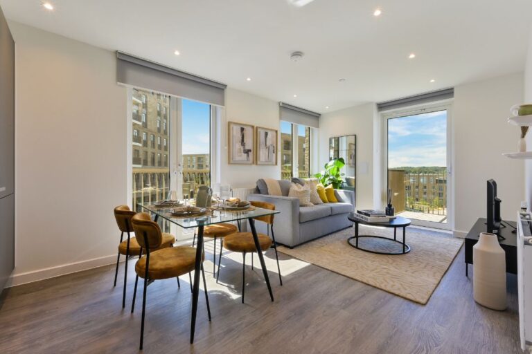 Living room at Wolff House apartment with large windows and natural light