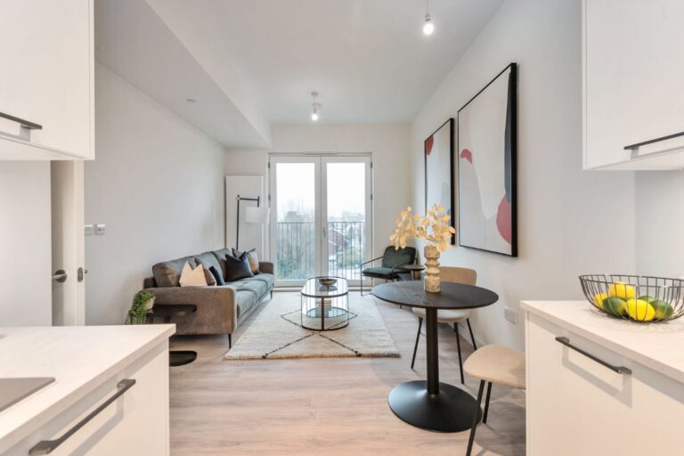 Lounge area inside Sheepcote Road apartment with dining space and artwork