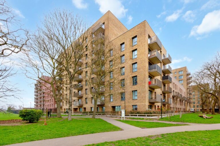 Outside Lampton Parkside showing full building amidst greenery and well kept landscaping