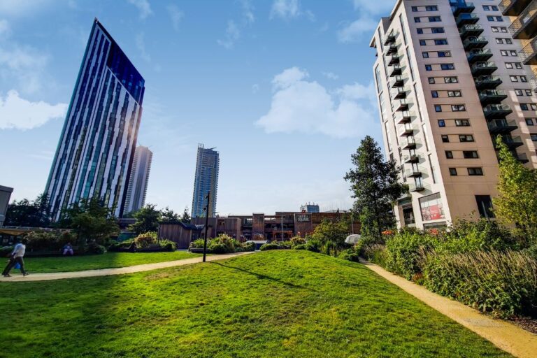 Landscaped green space at Elephant Park with modern towers in the background