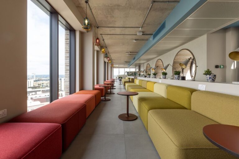 co working lounge space with seating and desks at The Robinson Wembley