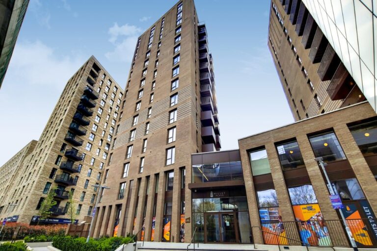 Street level view of Millet Place buildings with entrance and multiple residential towers