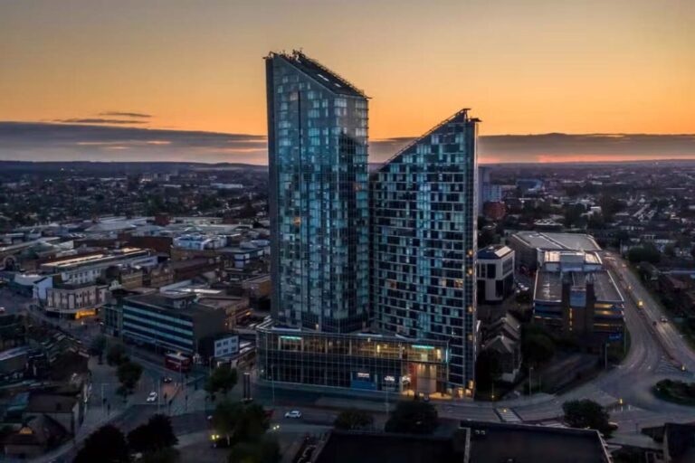 Pioneer Point towers in Ilford at sunset with city skyline views