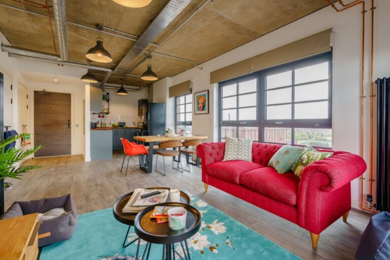 loft style open plan kitchen and living space at Ferrum Wembley apartment