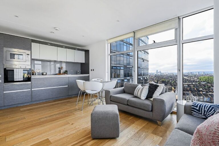 Open plan living space at Pioneer Point Ilford with floor to ceiling windows