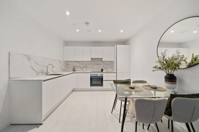 Modern fitted kitchen with integrated appliances at Hayes Village
