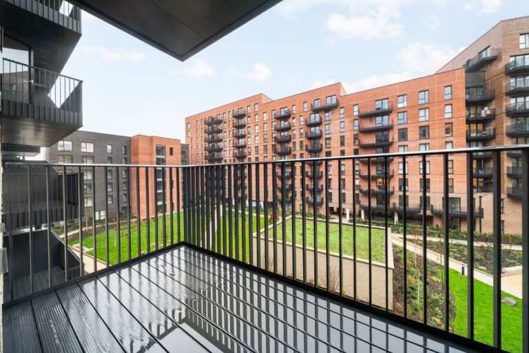 Private balcony overlooking landscaped courtyard