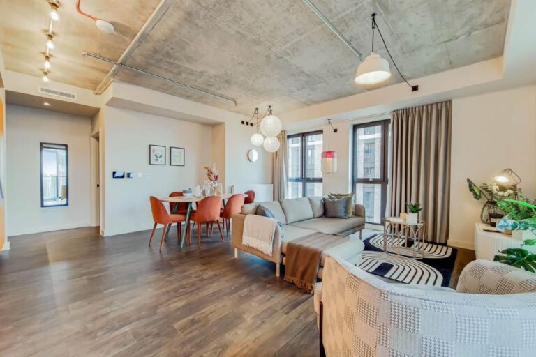 furnished living room with dining area at The Robinson Wembley apartment