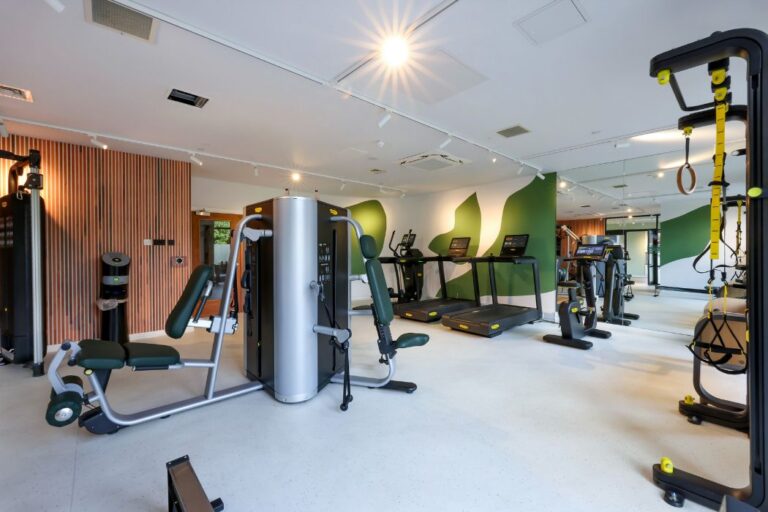 Fully equipped gym with cardio and strength machines at Sienna House