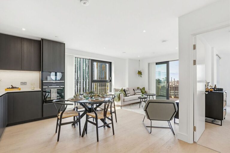 Bright apartment with open plan kitchen, dining area and living space with balcony access