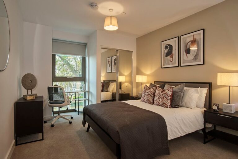 Apex Gardens bedroom with built in storage and desk area