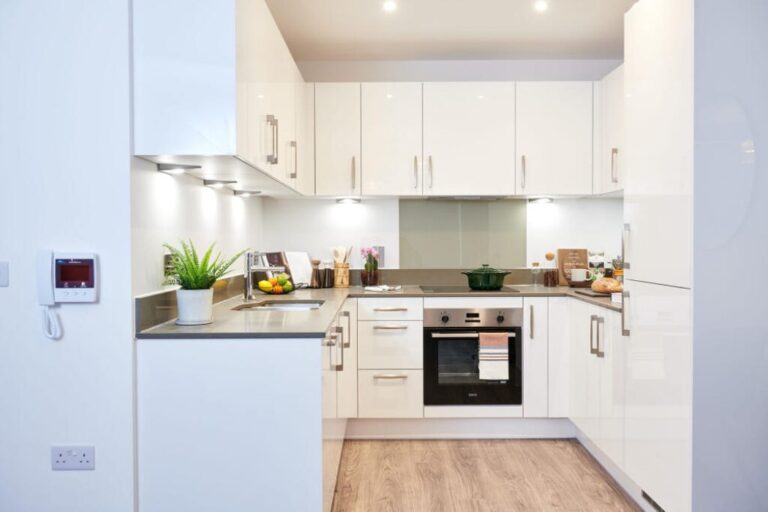 Modern fitted kitchen at Fortunes Dock Canning Town with integrated appliances and clean contemporary finish
