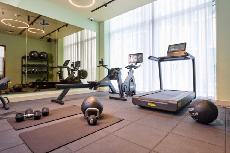 Residents gym at Fortunes Dock Canning Town with cardio equipment weights and modern fitness space