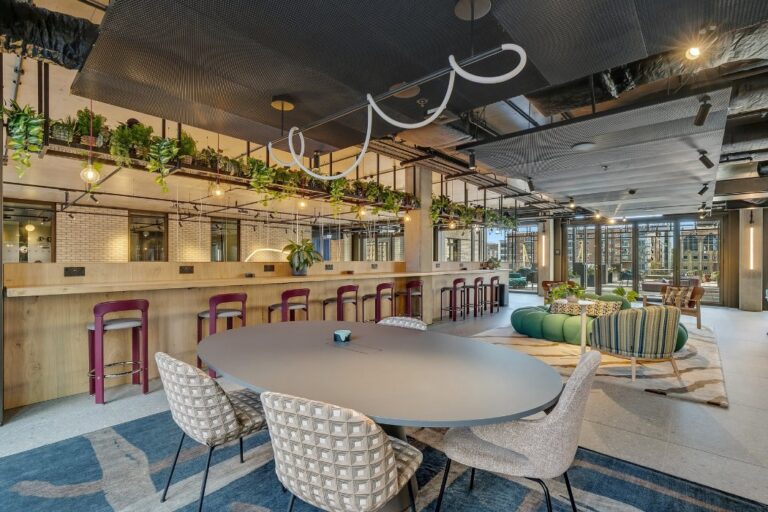 Residents co-working space at 50-60 Charter Street with bar-height seating, hanging plant installations and views to the street