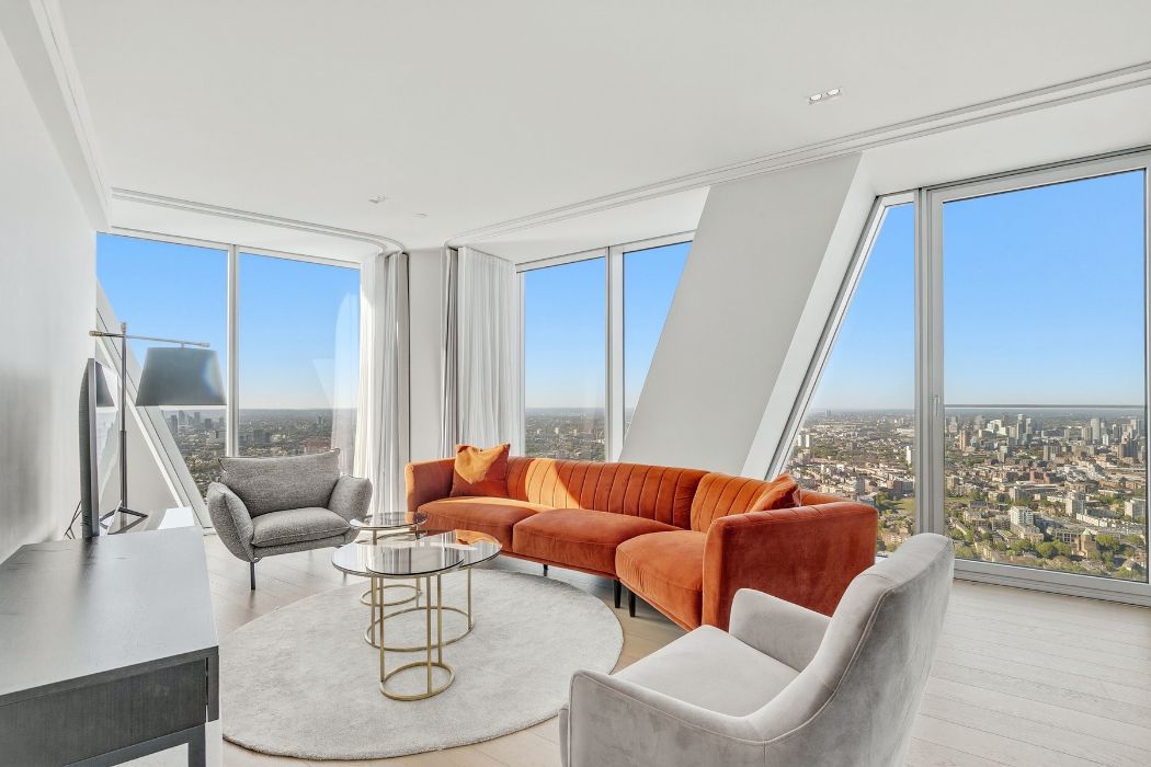 Living room inside a three bedroom apartment at Newfoundland with floor to ceiling skyline views