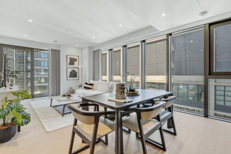 Open plan living room and kitchen inside an apartment at 10 George Street