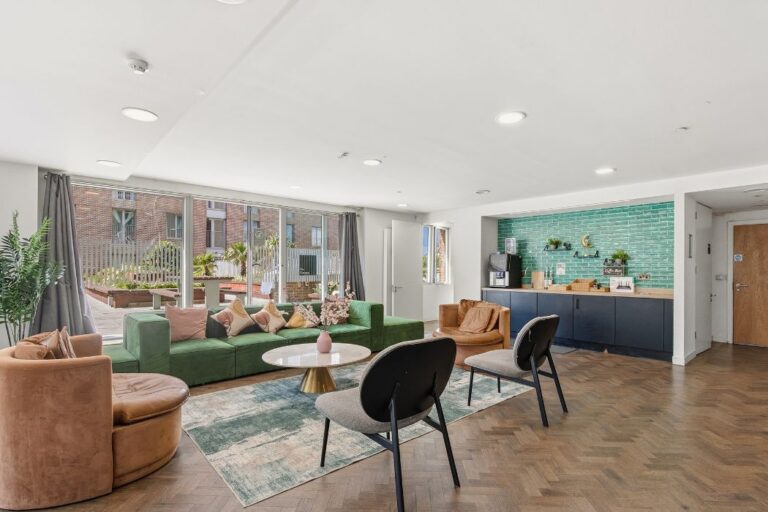 Residents lounge with windows overlooking the roof terrace