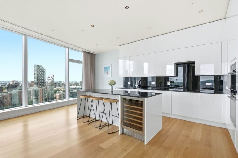 Contemporary kitchen at Arora Tower with island unit and integrated appliances
