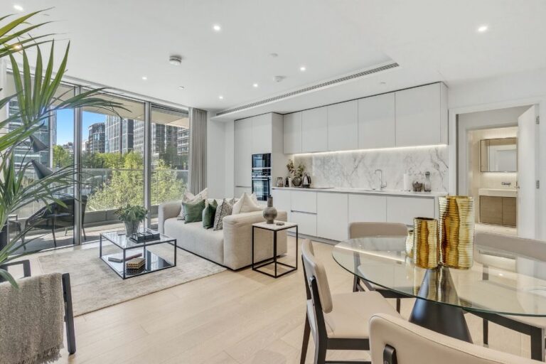 Open plan living and dining area at 8 Water Street with floor to ceiling windows and balcony access