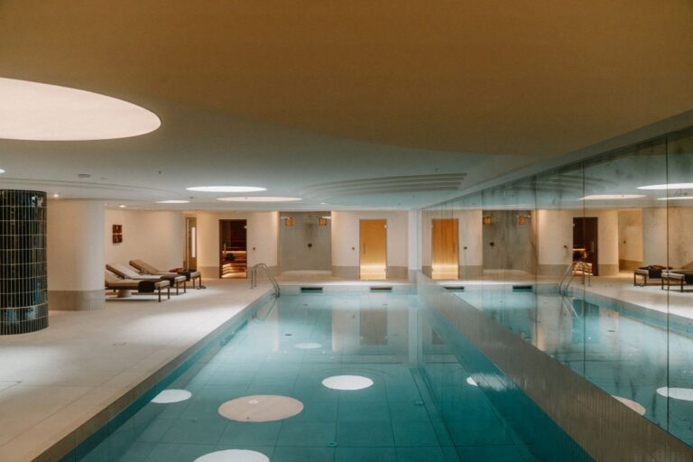 Indoor swimming pool with relaxation area, sauna and steam room access