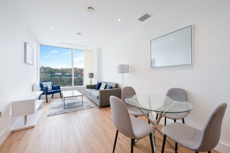 Open-plan lounge and dining area inside a furnished apartment at Westgate House