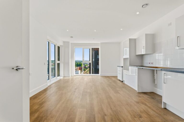 Open-plan living area in 2 bedroom apartment with modern fitted kitchen at Ilderton Yard