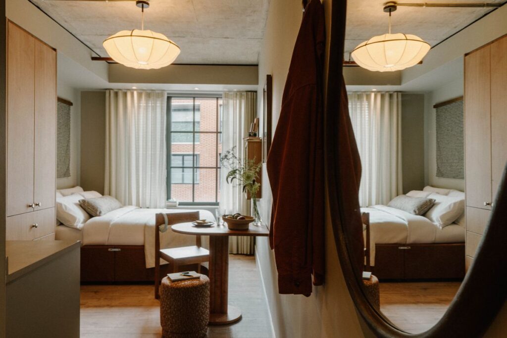 Fully furnished studio apartment with built-in storage and dining area