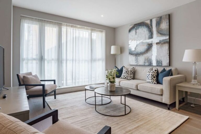 Bright furnished living room at Circus Apartments with floor-to-ceiling windows