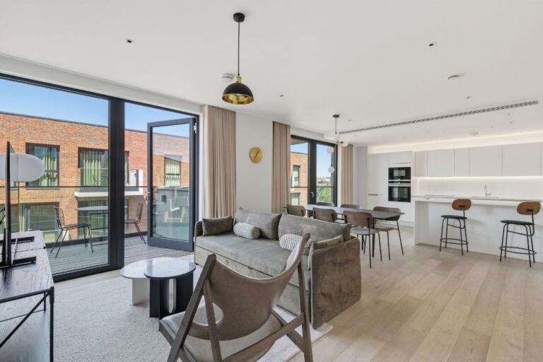 Bright open-plan apartment with modern kitchen, dining area, living space and private balcony